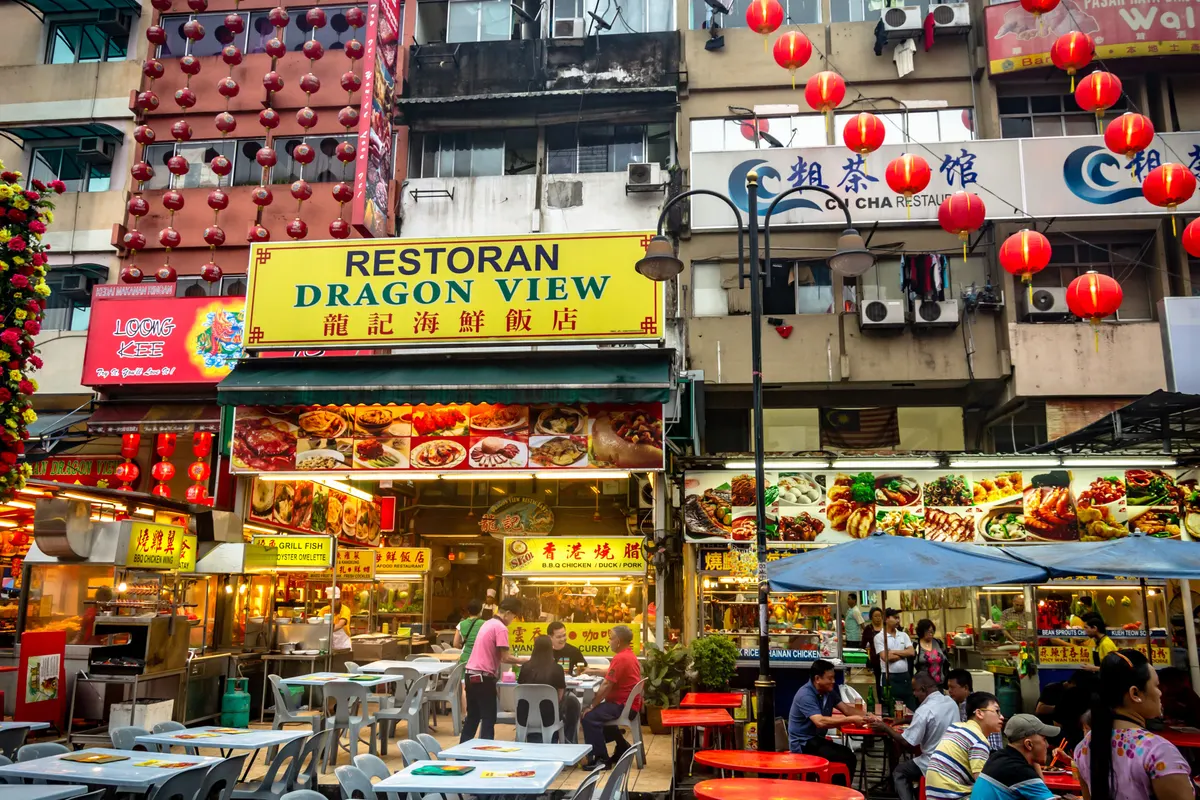 Colourful restaurants and diners along Jalan Alor food street in Kuala Lumpur