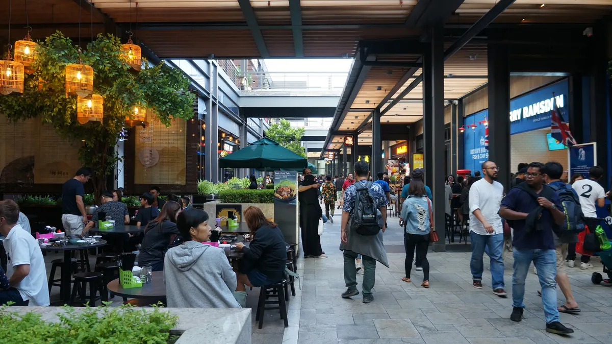 Diners and shoppers at an open-air walkway at Genting Highlands